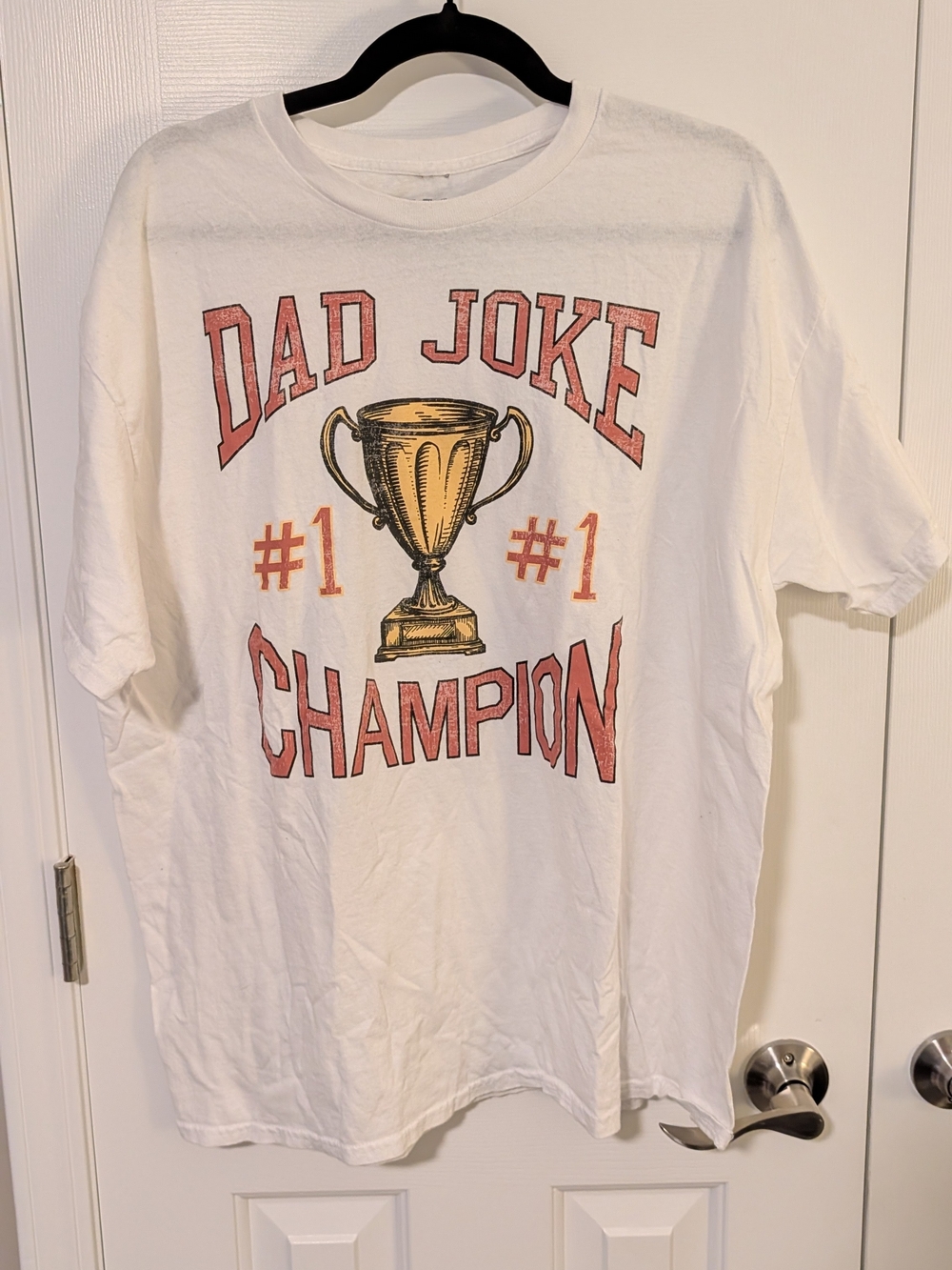 MAD Engine White Men's 'Dad Joke Champion' Graphic Tee with Gold Trophy